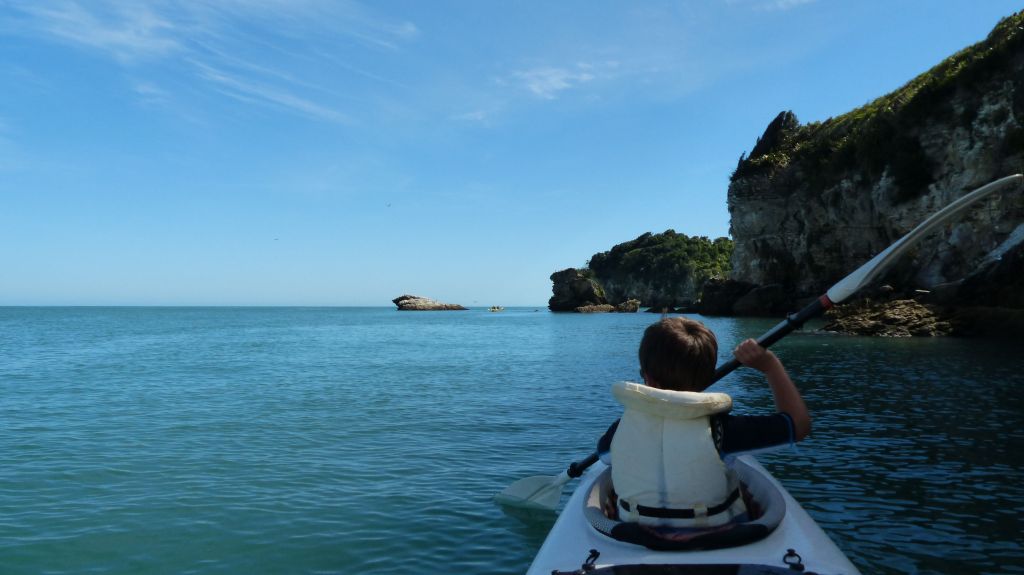 Mac kayaking on by Abel Tasman